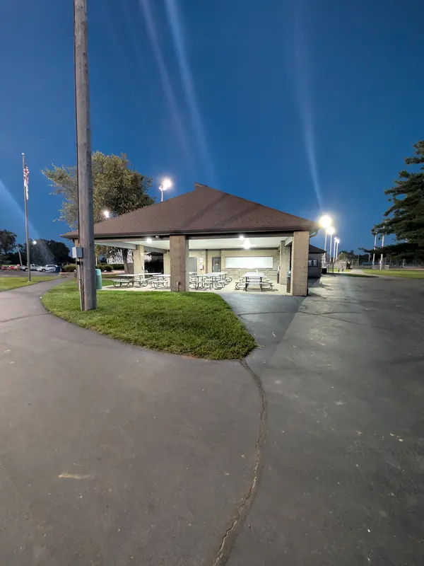 Covered pavilion with picnic tables and a concession window at Blue Ash Sports Center